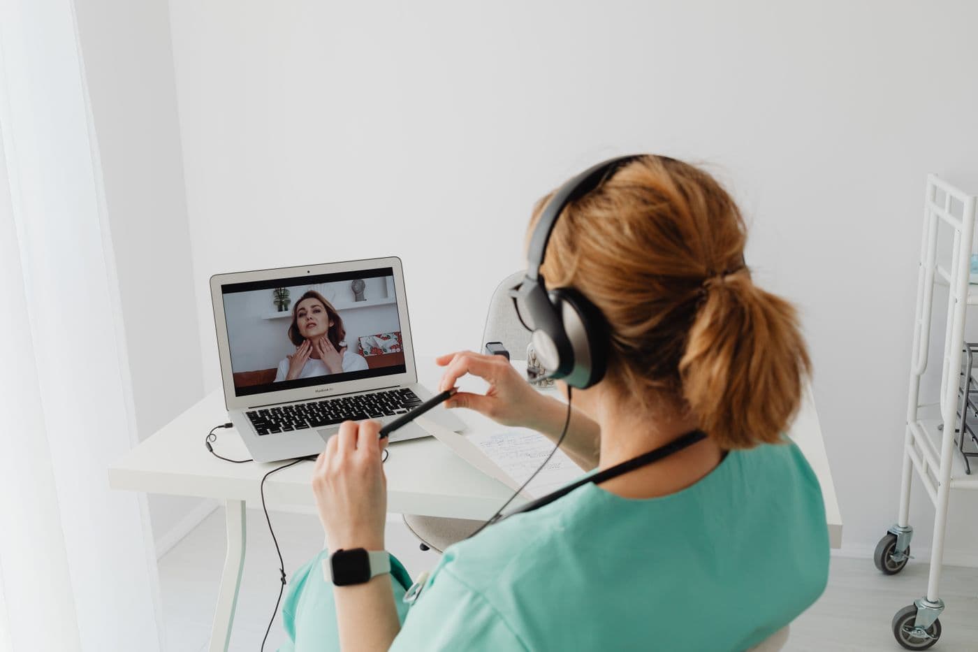 A care coordinator scheduling assessment visits on a laptop